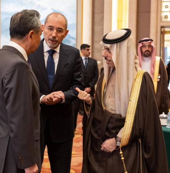 Chinese Foreign Minister Wang Yi meets Saudi Foreign Minister Prince Faisal Bin Farhan and other members of the Islamic Ministerial Committee in Beijing on Monday.