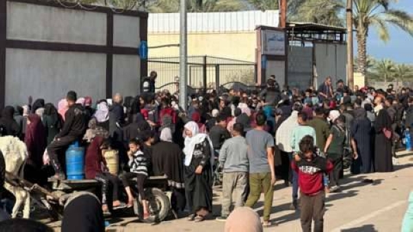 Hundreds stand in the queue for cooking gas in Deir al-Balah, central Gaza.