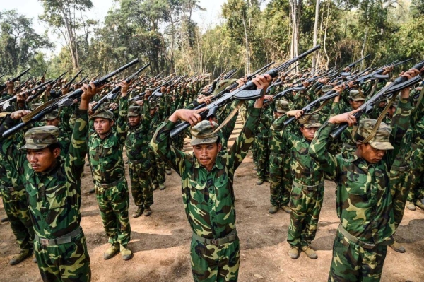 In this photo taken on March 8, 2023 members of ethnic rebel group Ta'ang National Liberation Army (TNLA) take part in a training exercise at their base camp in the forest in Myanmar's northern Shan State