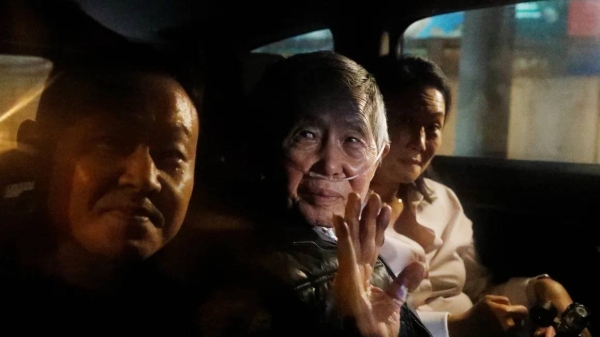 Former president of Peru Alberto Fujimori in a car with son Kenji Fujimori and daughter Keiko Fujimori after his release on December 6, 2023, in Lima, Peru