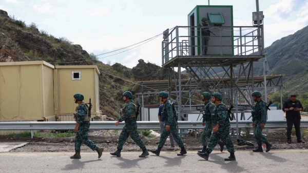Azerbaijani soldiers walk at the Lachin checkpoint, on September 26, 2023