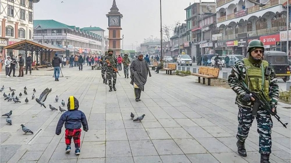 Indian paramilitary personnel patrol along a road in Srinagar on Monday, ahead of Supreme Court’s verdict on Article 370. — courtesy AFP