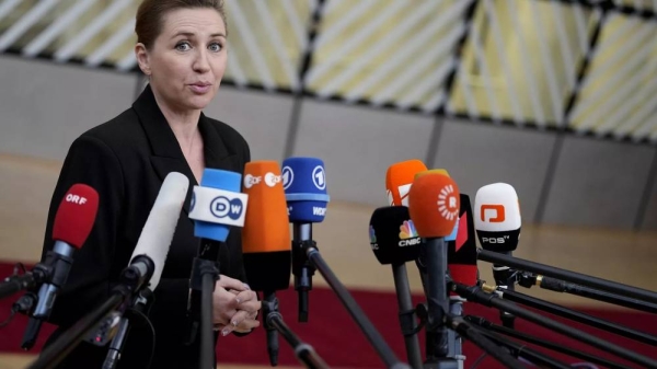 Denmark's Prime Minister Mette Frederiksen speaks with the media as she arrives for an EU summit at the European Council building in Brussels, Thursday, Dec. 14, 2023 -