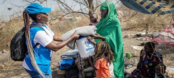 UNHCR distributes relief items to returnees at a transit centre in Renk, South Sudan. — courtesy UNHCR/Andrew McConnell