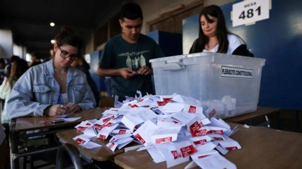Officials count ballots after polls closed on the day of the referendum on a new Chilean constitution in Santiago, Chile
