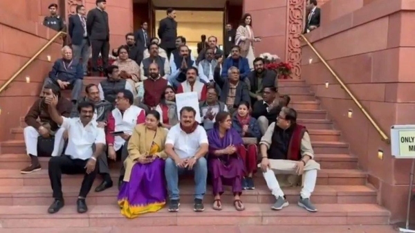 Some of the suspended MPs protested outside parliament on Monday