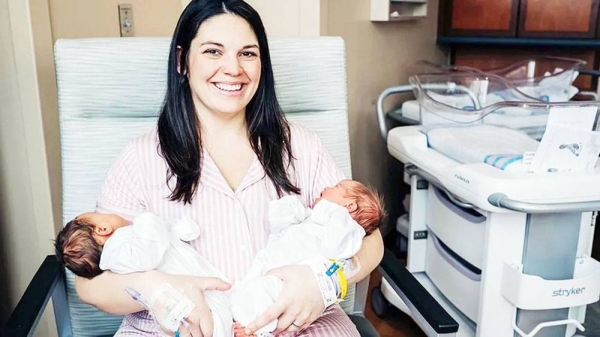 Kelsey Hatcher holds her two newborn babies — courtesy Andrea Mabry/University of Alabama at Birmingham