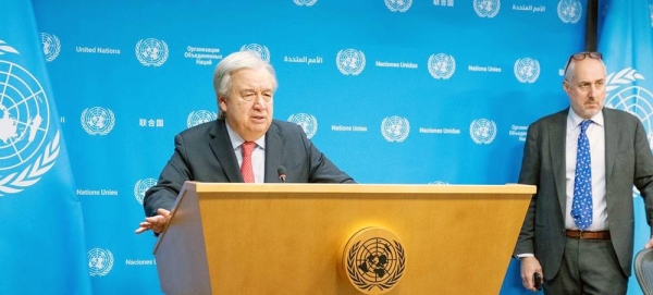 Secretary-General António Guterres (at podium) briefs reporters on the situation in Gaza. At right is Stéphane Dujarric, spokesperson for the Secretary-General. — courtesy UN Photo/Eskinder Debebe