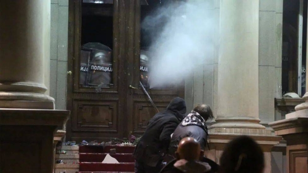 Demonstrators were met by riot police outside Belgrade City Hall on Sunday