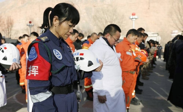 People pay a silent tribute during a commemorative event for earthquake victims at a square in Dahejia Township of Jishishan County, northwest China's Gansu Province, Monday. — courtesy Xinhua