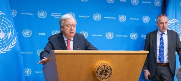 Secretary-General António Guterres (at podium) briefs reporters on the situation in Gaza. At right is Stéphane Dujarric, spokesperson for the Secretary-General. — courtesy UN Photo/Eskinder Debebe
