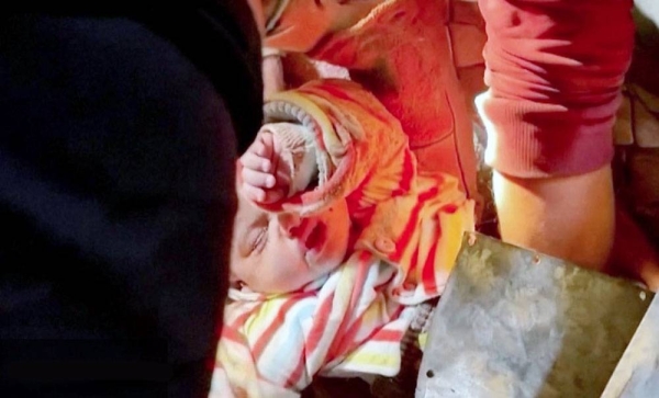 Baby pulled alive from rubble after Israeli air strike on Rafah.