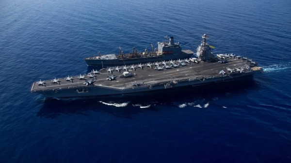 The USS Gerald R. Ford steams alongside USNS Laramie (T-AO-203) during a fueling-at-sea in the eastern Mediterranean Sea on October 11, 2023