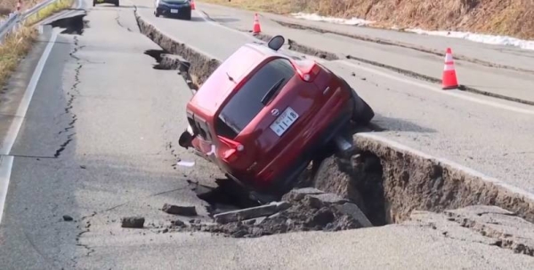 Homes collapsed, buildings caught fire and roads were extensively damaged when the powerful earthquake shook Japan on New Year's Day.