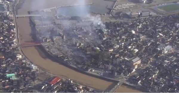 Homes collapsed, buildings caught fire and roads were extensively damaged when the powerful earthquake shook Japan on New Year's Day.