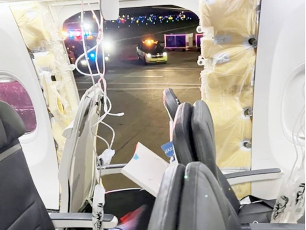 The seat immediately next to the broken fuselage was said by passengers to be unoccupied. — courtesy Reuters