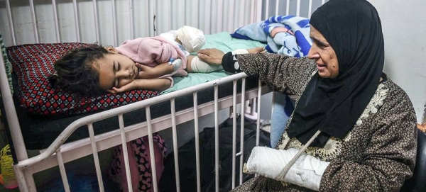 A mother cares for her daughter at Nasser Hospital in Khan Younis in the south of Gaza. — courtesy UNICEF/Abed Zaqout