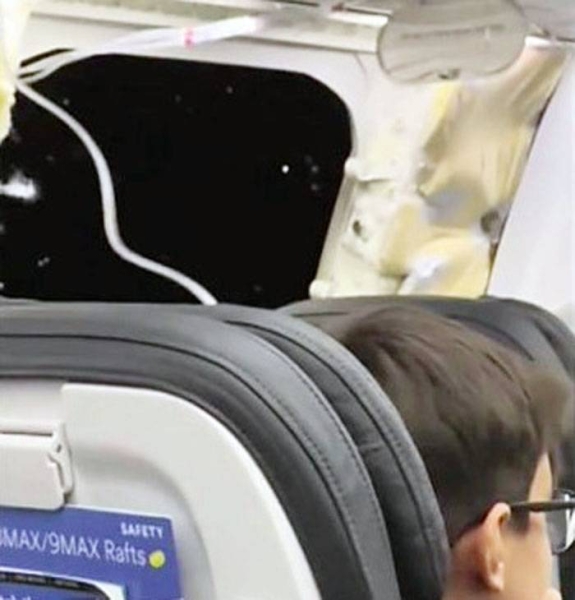 File photo of on board Alaska Airlines flight during mid-air blow out.