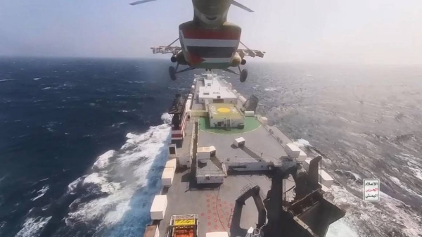 This handout screen grab captured from a video shows Yemen's Houthi fighters' takeover of the Galaxy Leader Cargo in the Red Sea coast off Hudaydah, on November 20, 2023 in the Red Sea, Yemen