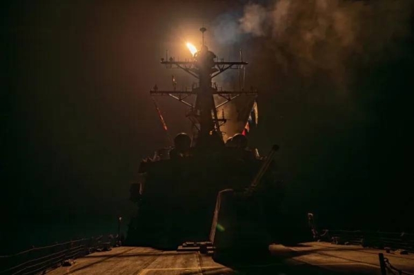 A missile is launched from a warship during a US-led coalition operation against Houthi targets in Yemen, from an undisclosed location, January 12, 2024
