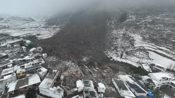 Rescuers work at the site of a landslide in Liangshui village in China's Yunnan province on January 23, 2024