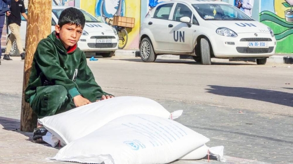 UNRWA distributes flour to Palestinian families who fled their homes and took refuge in UNRWA schools as Israeli attacks continue in Rafah, Gaza. — courtesy Getty Images