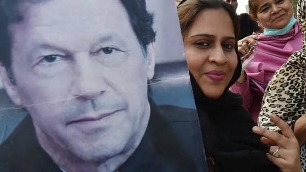 Supporters of Imran Khan's party attend a rally ahead of the general elections in Karachi