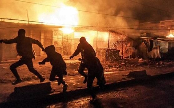 People flee fires and smoke after huge explosion