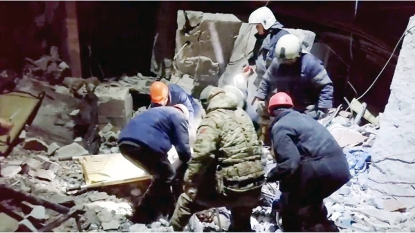 Emergency responders retrieve bodies from the rubble of the destroyed bakery building. — courtesy Russian Emergencies Ministry