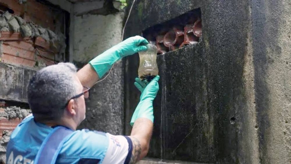 
A municipal health worker inspects an old warehouse for stagnant water which could serve as a potential breeding site of Aedes aegypti mosquitoes, known to spread the dengue, in Rio de Janeiro, Brazil. — courtesy Reuters