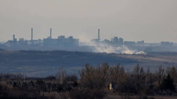 Smoke rises over an industrial site in Avdiivka on Thursday