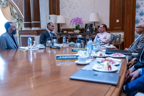 Malaysia’s Prime Minister Anwar Ibrahim holds talks with Sheikh Abdullah Saleh Kamel, president of the Islamic Chamber of Commerce, Industry and Agriculture, in Kuala Lumpur on Friday.