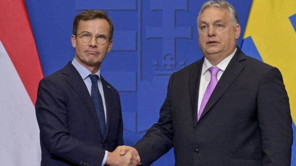 Sweden's Prime Minister Ulf Kristersson, left, shakes hands with his Hungarian counterpart Viktor Orban at the Carmelite Monastery in Budapest, Hungary, Feb 23, 2024