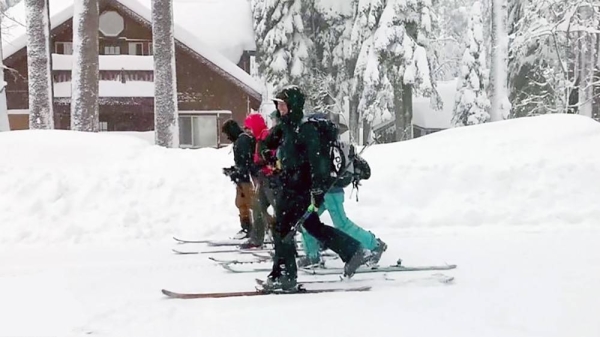 People plow through the snow as storms sweep parts of California and Nevada in western US