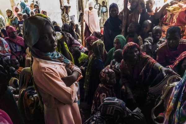 Civilians fleeing conflict in Sudan wait for asylum registration procedures in Renk, South Sudan, on December 18, 2023