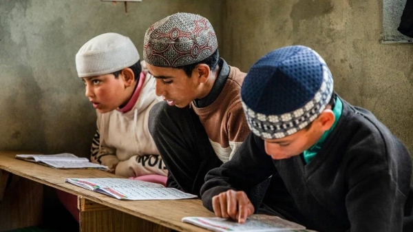 Muslim students read the Quran at an Islamic school or madrasa in Srinagar, Indian-administered Kashmir