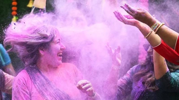 Women smeared in Holi colors in Chennai in southern India's Tamil Nadu