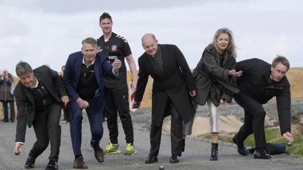 Politicians bowl at the construction site of the Northvolt factory, Hedwigenkoog, Germany, Monday, March 25, 2024