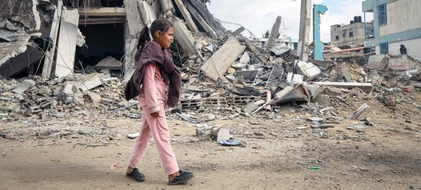 A young girl walks through destroyed streets in Khan Younis, in the southern Gaza Strip. — courtesy UNICEF/Eyad El Baba