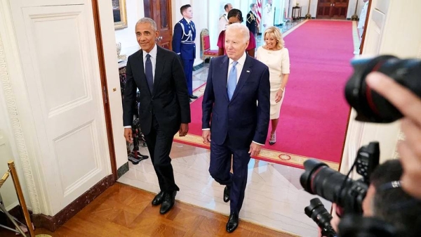 US President Joe Biden and first lady Jill Biden along with former President Barack Obama and former first lady Michelle Obama arrive in the East Room of the White House in Washington, DC, on Sept. 7, 2022. (file). — courtesy Getty Images