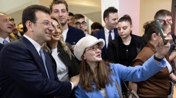 Istanbul mayor and candidate Ekrem Imamoglu (2-L) of the main opposition Republican People's Party (CHP) voted for the local elections at a polling station in Istanbul, Turkey, Sunday. — courtesy Tolga Bozoglu/EPA-EFE