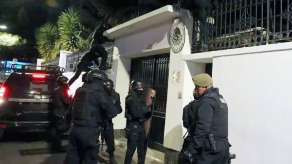 Police outside the entrance to the Mexican embassy in Quito — courtesy EPA