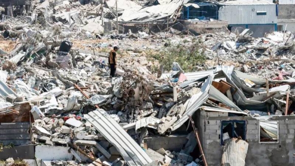 A man stands in the midst of devastation in Khan Younis after 4 months of Israeli bombardment in Khan Yunis. — courtesy Getty Images