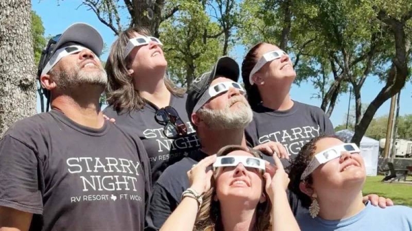 Sky watchers test their eclipse glasses in Texas.