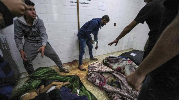 Bodies of people killed in the Israeli bombardment of the Gaza Strip are brought to al Aqsa Hospital in Deir al Balah, Gaza Strip, April 9, 2024