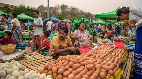 Vendors wait to sell eggs to customers at Myo Ma market in Naypyidaw on March 26, 2024