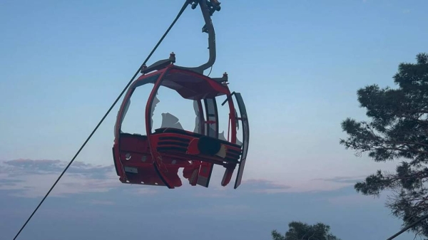 A severely damaged cabin of a cable car transportation system is seen outside Antalya, southern Turkey, Friday, April 12, 2024