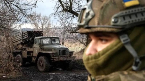 File image of a Ukrainian solider and a military vehicle in a wintry scene. — courtesy Reuters