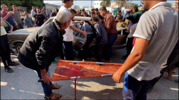 The scene outside Al-Aqsa Martyrs Hospital as victims from the strike on Gaza’s Al-Maghazi refugee camp arrive