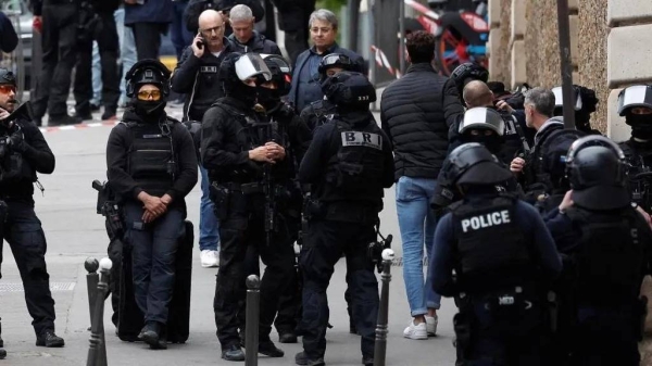 Police and members of France's elite BRI brigade were pictured surrounding the area